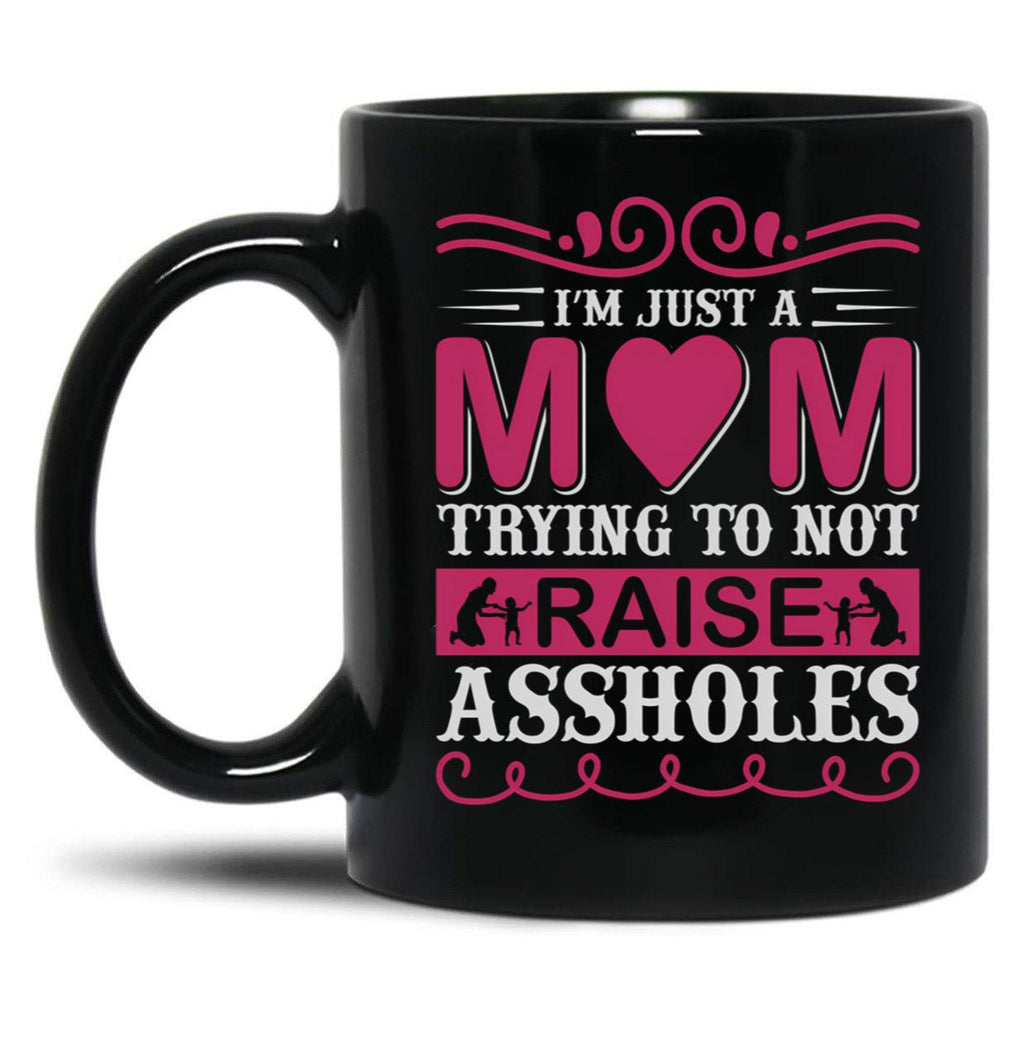 I'M Just A Mom Trying To Not Raise Assholes Black Coffee Mug