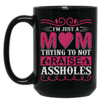I'M Just A Mom Trying To Not Raise Assholes Black Coffee Mug
