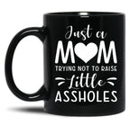 Just A Mom Trying Not To Raise Little Assholes Black Coffee Mug