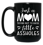 Just A Mom Trying Not To Raise Little Assholes Black Coffee Mug